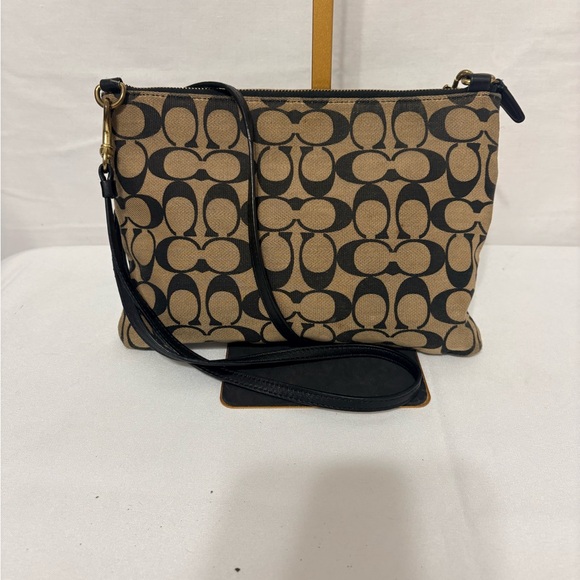Canvas crossbody bag in khaki and black with a turnlock closure. - Picture 3 of 9